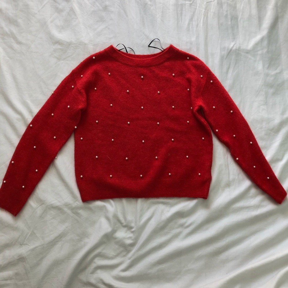 Red sweater with pearls
